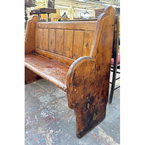 163 - A Victorian pitch pine church pew - approx. 101cm high x 137cm wide x 45cm deep