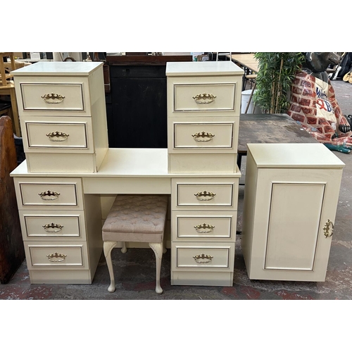 163A - A white laminate bedroom suite comprising pair of bedside chests of drawers, dressing table with sto... 