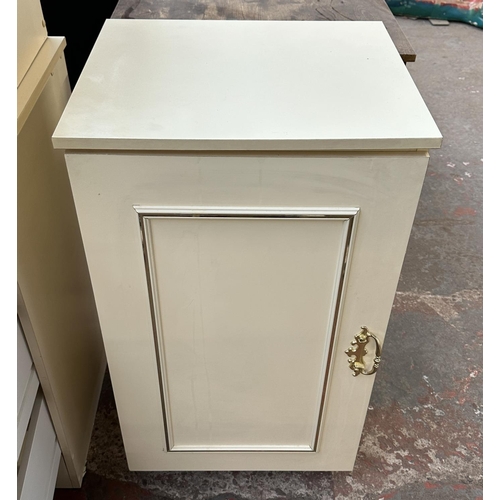 163A - A white laminate bedroom suite comprising pair of bedside chests of drawers, dressing table with sto... 