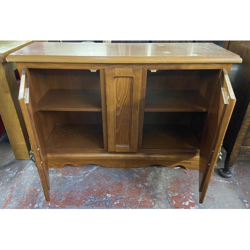 165 - A modern beech effect sideboard - approx. 80cm high x 120cm wide x 39cm deep