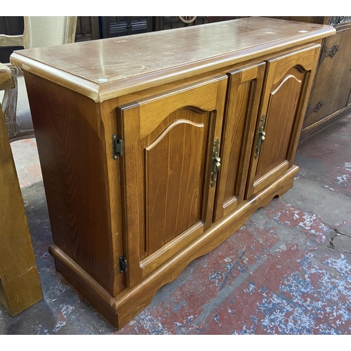 165 - A modern beech effect sideboard - approx. 80cm high x 120cm wide x 39cm deep