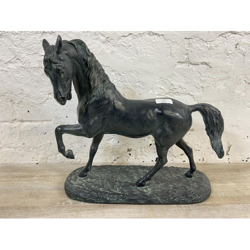 166 - A 19th century style bronzed plaster horse figurine - approx. 38cm high x 40cm wide x 15cm deep