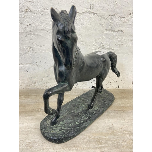 166 - A 19th century style bronzed plaster horse figurine - approx. 38cm high x 40cm wide x 15cm deep