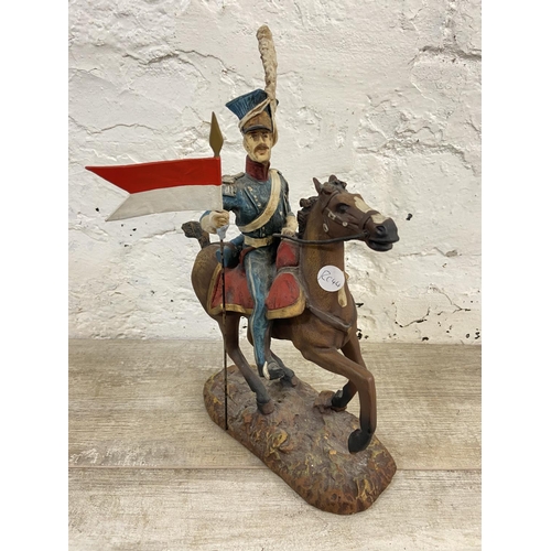 167 - A hand painted plaster Polish Cavalry Lancer on horse figurine - approx. 34cm high