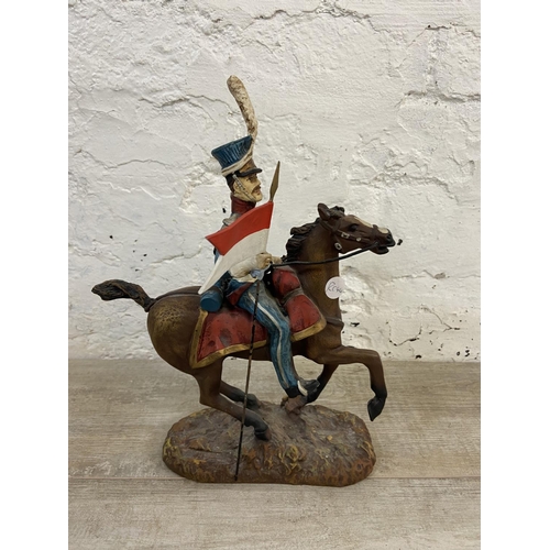 167 - A hand painted plaster Polish Cavalry Lancer on horse figurine - approx. 34cm high