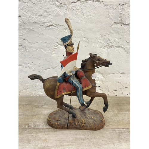 167 - A hand painted plaster Polish Cavalry Lancer on horse figurine - approx. 34cm high