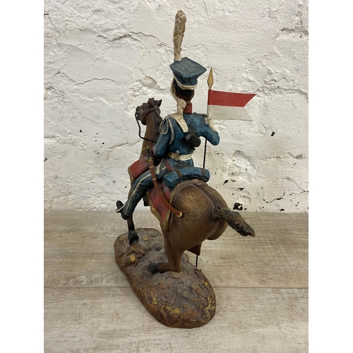 167 - A hand painted plaster Polish Cavalry Lancer on horse figurine - approx. 34cm high