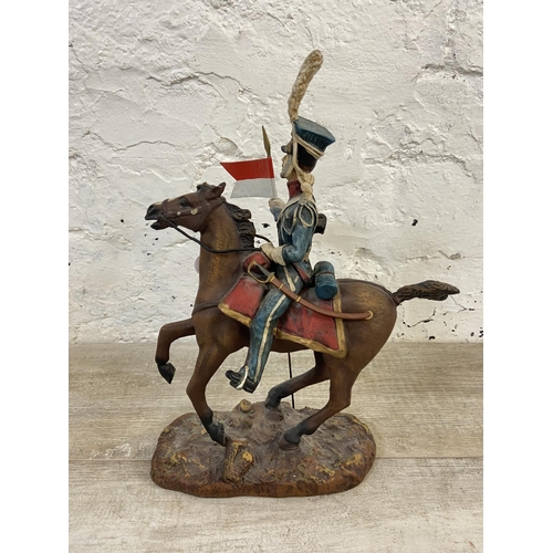 167 - A hand painted plaster Polish Cavalry Lancer on horse figurine - approx. 34cm high