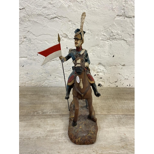 167 - A hand painted plaster Polish Cavalry Lancer on horse figurine - approx. 34cm high