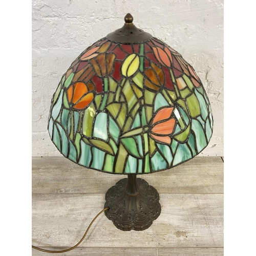 168 - A Tiffany style stained glass and bronzed cast metal table lamp - approx. 64cm high