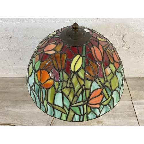 168 - A Tiffany style stained glass and bronzed cast metal table lamp - approx. 64cm high