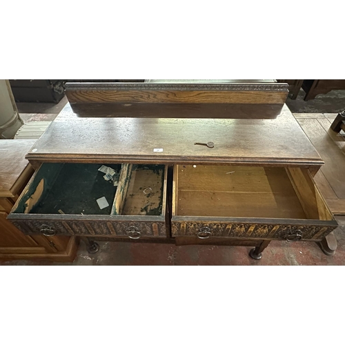 169 - An early 20th century carved oak sideboard - approx. 104cm high x 122cm wide x 47cm deep