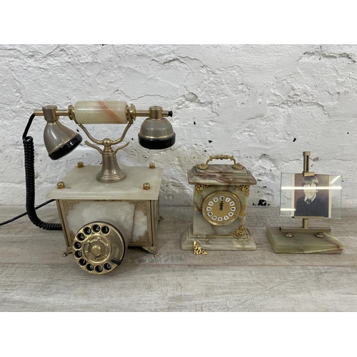 17 - Fifteen onyx and gilt metal items to include rotary dial telephone, jewellery box, table lighters, p... 