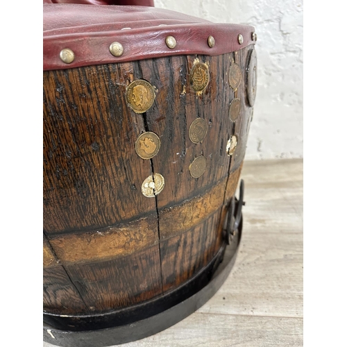 172 - An antique coopered oak and iron banded barrel chair with red vinyl upholstery - approx. 66cm high x... 