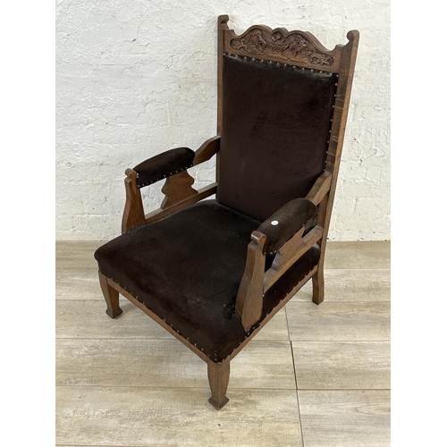 174 - A late Victorian/Edwardian carved oak and brown fabric upholstered parlour chair