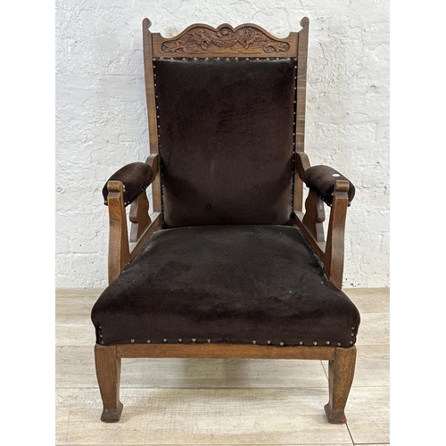 174 - A late Victorian/Edwardian carved oak and brown fabric upholstered parlour chair