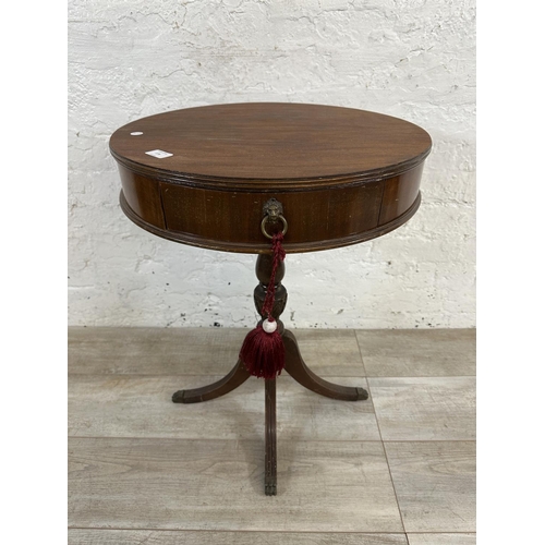 175 - An American Imperial of Grand Rapids mahogany drum table - approx. 67cm high x 52cm diameter