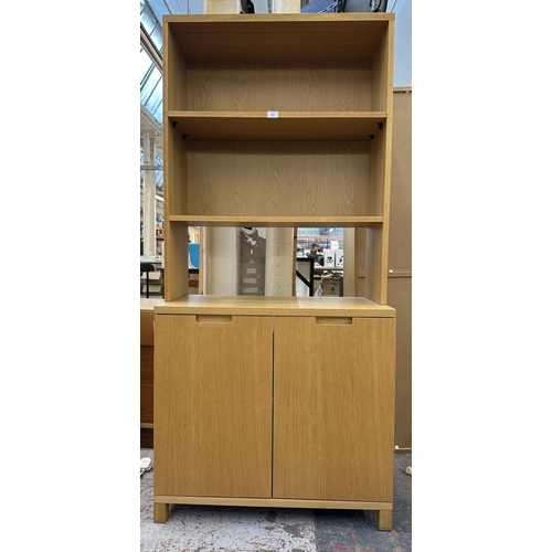 184 - A modern oak effect bookcase - approx. 174cm high x 79cm wide x 43cm deep