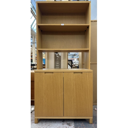 184 - A modern oak effect bookcase - approx. 174cm high x 79cm wide x 43cm deep