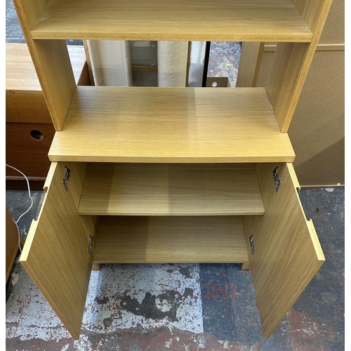 184 - A modern oak effect bookcase - approx. 174cm high x 79cm wide x 43cm deep