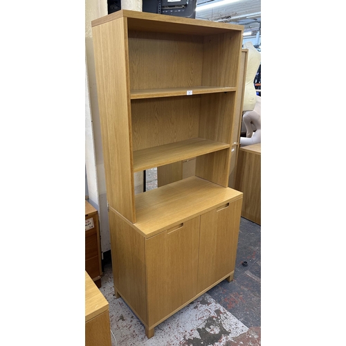 184 - A modern oak effect bookcase - approx. 174cm high x 79cm wide x 43cm deep