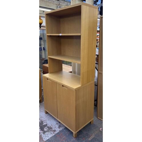 184 - A modern oak effect bookcase - approx. 174cm high x 79cm wide x 43cm deep