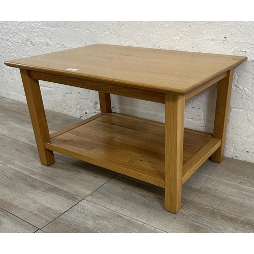 186 - A modern oak rectangular two tier coffee table - approx. 45cm high x 53cm wide x 76cm long