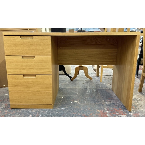 187 - A modern oak effect office desk - approx. 75cm high x 120cm wide x 65cm deep