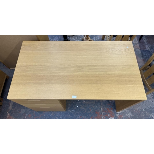 187 - A modern oak effect office desk - approx. 75cm high x 120cm wide x 65cm deep