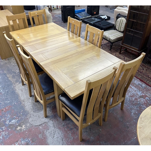 188 - A modern solid oak extending dining table and eight chairs - approx. 78cm high x 91cm wide x 199cm l... 