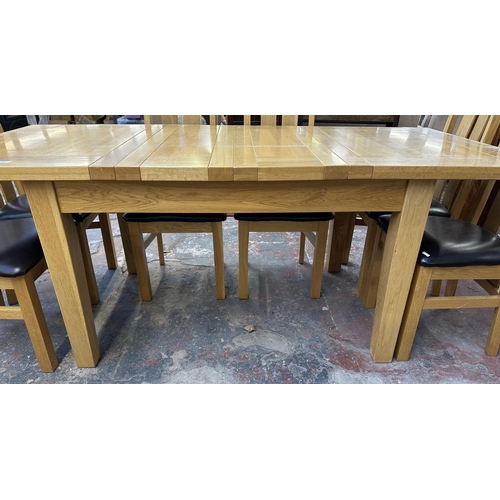 188 - A modern solid oak extending dining table and eight chairs - approx. 78cm high x 91cm wide x 199cm l... 