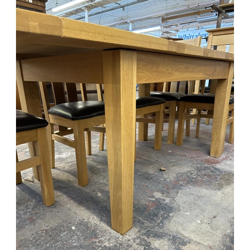 188 - A modern solid oak extending dining table and eight chairs - approx. 78cm high x 91cm wide x 199cm l... 