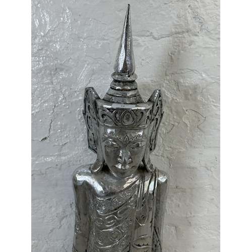 19 - A Thai silver painted carved hardwood buddha statue - approx. 116cm high