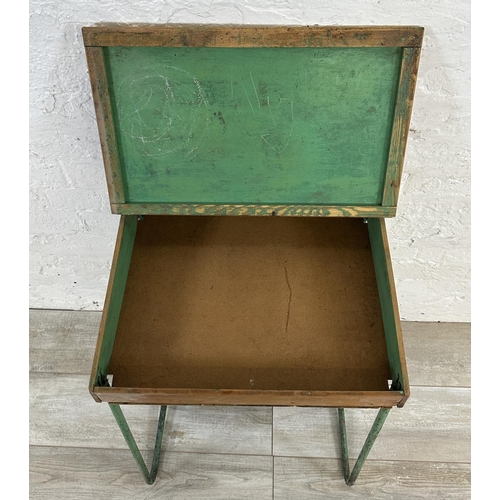 22 - A mid 20th century beech and plywood child's school desk on green painted tubular metal stand - appr... 