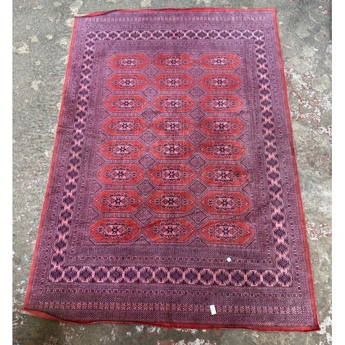 24A - A mid 20th century Bokhara rug - approx. 190cm x 130cm