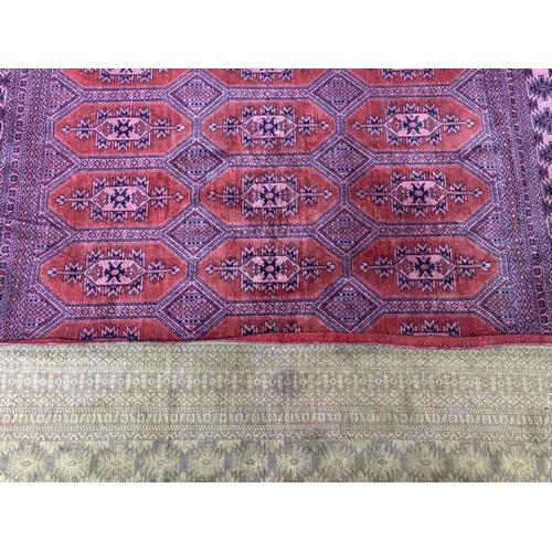 24A - A mid 20th century Bokhara rug - approx. 190cm x 130cm