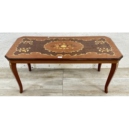 30 - An Italian Sorrento marquetry inlaid walnut coffee table - approx. 49cm high x 47cm wide x 105cm lon... 