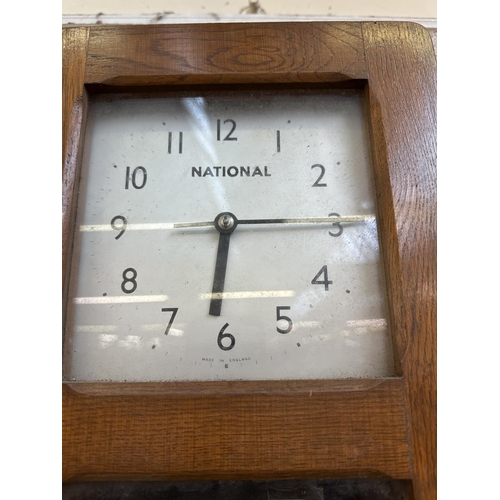 32A - A mid 20th century National oak cased electric master clock - approx. 73cm high x 25cm wide x 13cm d... 