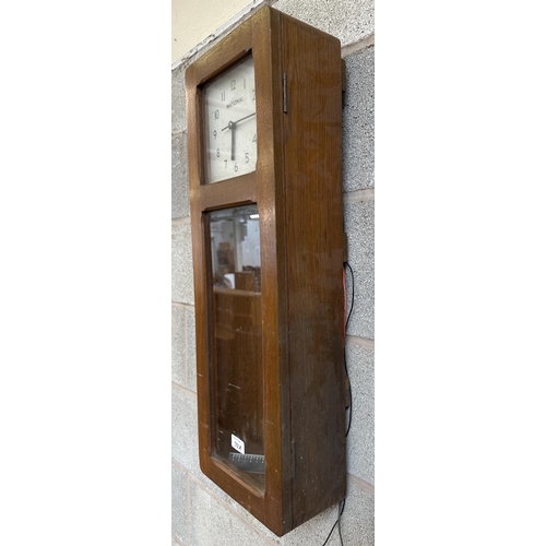 32A - A mid 20th century National oak cased electric master clock - approx. 73cm high x 25cm wide x 13cm d... 