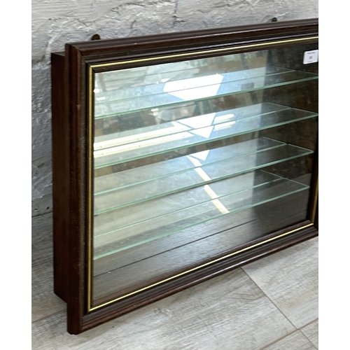 33 - An oak effect wall hanging model display cabinet with four glass shelves - approx. 43cm high x 61cm ... 