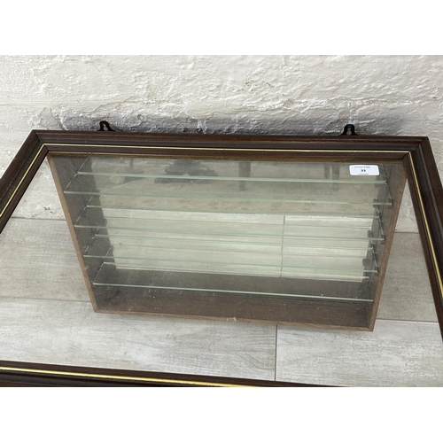 33 - An oak effect wall hanging model display cabinet with four glass shelves - approx. 43cm high x 61cm ... 