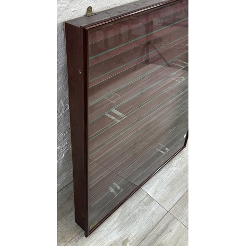 34 - A mahogany effect wall hanging model display cabinet with eleven glass shelves - approx. 86cm high x... 