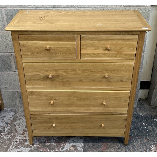 37 - A modern oak chest of drawers - approx. 120cm high x 99.5cm wide x 42cm deep