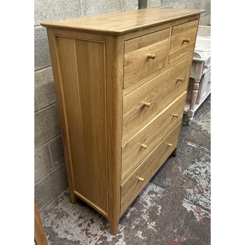 37 - A modern oak chest of drawers - approx. 120cm high x 99.5cm wide x 42cm deep