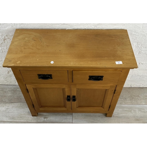 38 - A modern oak sideboard - approx. 80cm high x 80cm wide x 34cm deep