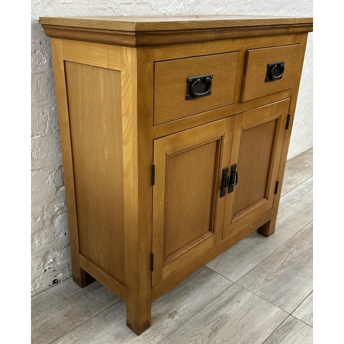 38 - A modern oak sideboard - approx. 80cm high x 80cm wide x 34cm deep