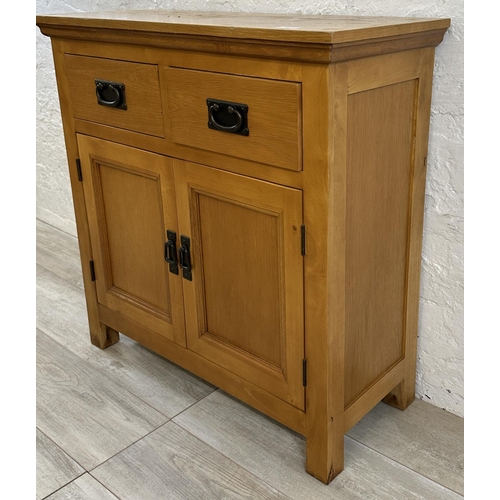 38 - A modern oak sideboard - approx. 80cm high x 80cm wide x 34cm deep