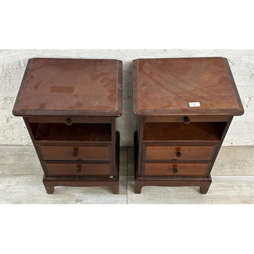 40 - A pair of Stag Minstrel mahogany bedside cabinets - approx. 66cm high x 40cm wide x 32cm deep