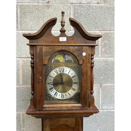 41 - A German Emperor walnut cased grandfather clock with pendulum and weights - approx. 188cm high