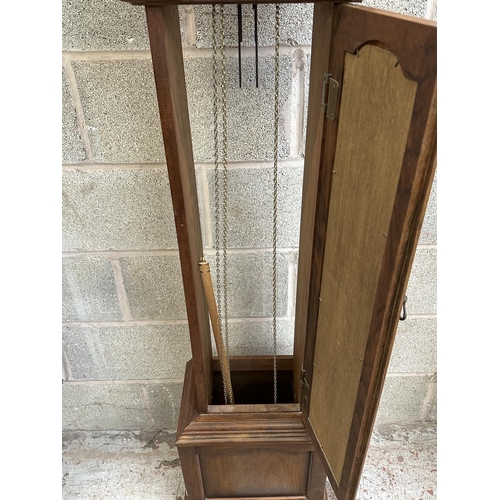 41 - A German Emperor walnut cased grandfather clock with pendulum and weights - approx. 188cm high